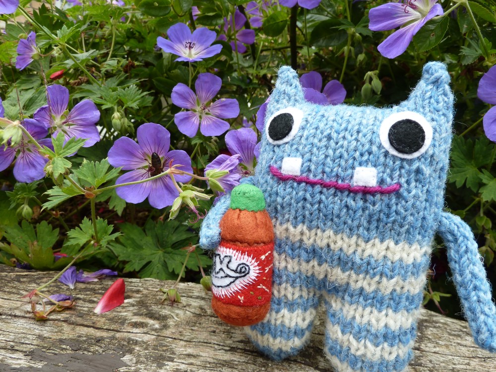 Red Lemonade Beastie in the Garden - CrawCrafts Beasties
