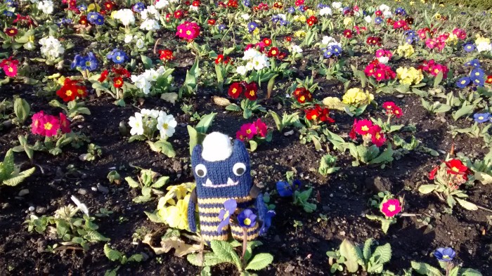 Explorer Beastie Enjoys the Spring Flowers - CrawCrafts Beasties